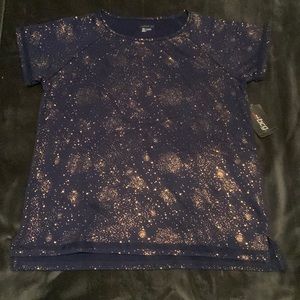 A navy blue bcg shirt with gold star patterning. It’s a size 16 (xl) in girls.